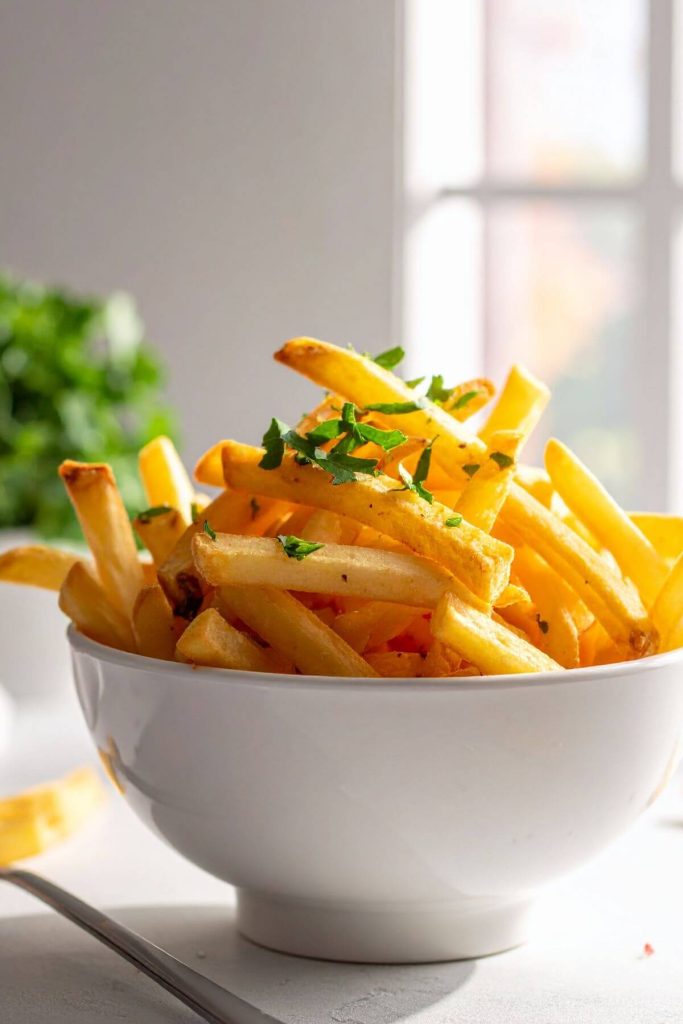 Bowl of French Fries with seasonings