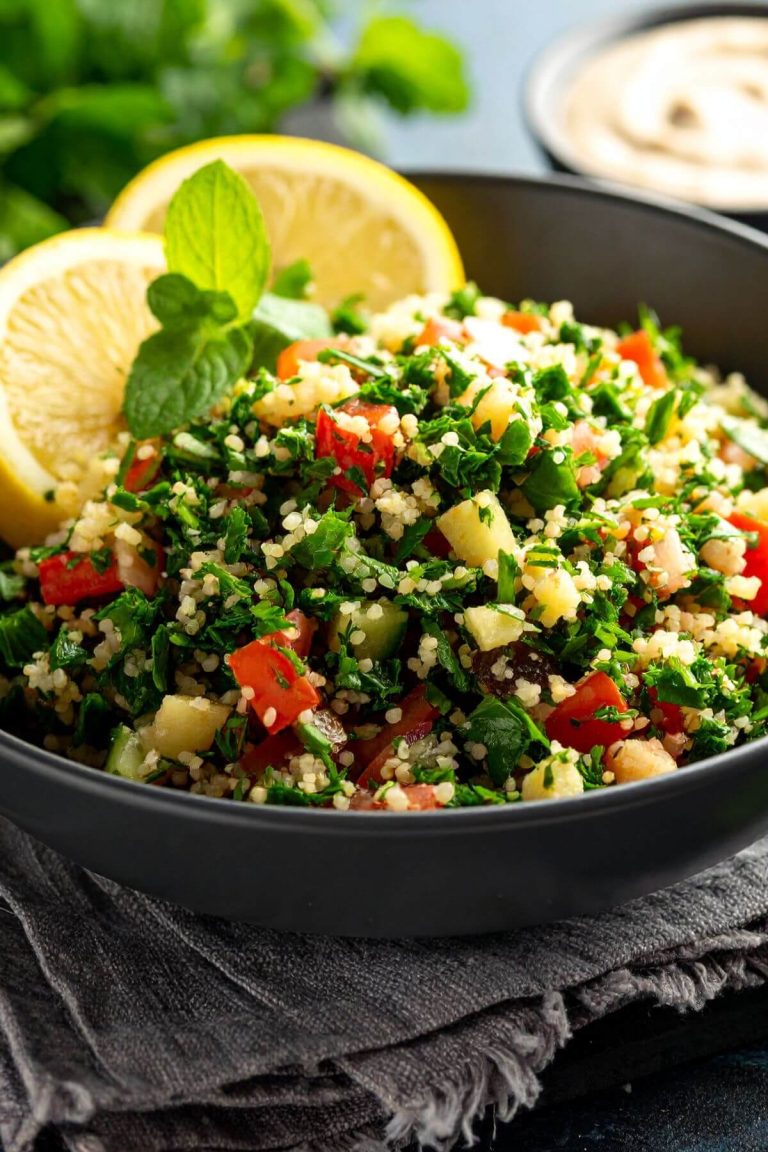 Bowl of Tabbouleh Salad with lemon wedge