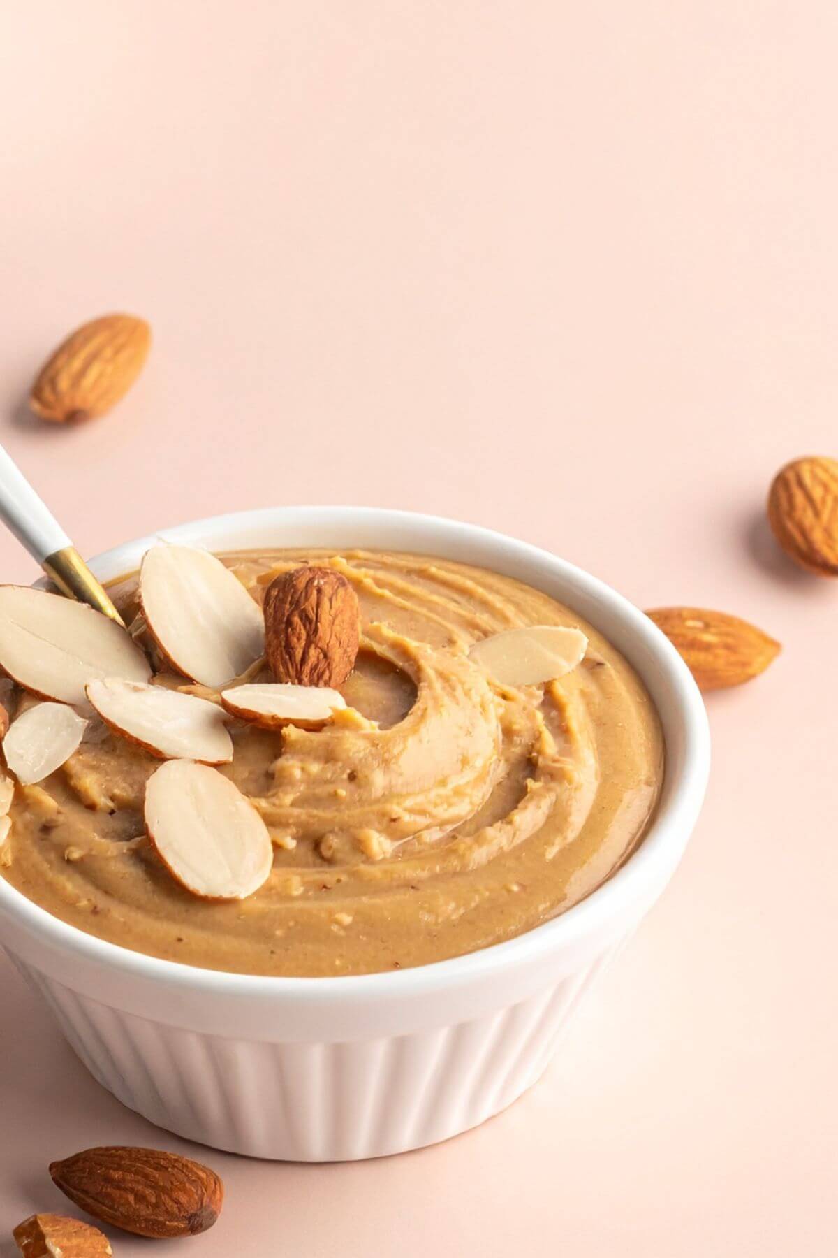 Small bowl of Almond butter with chopped almond garnish