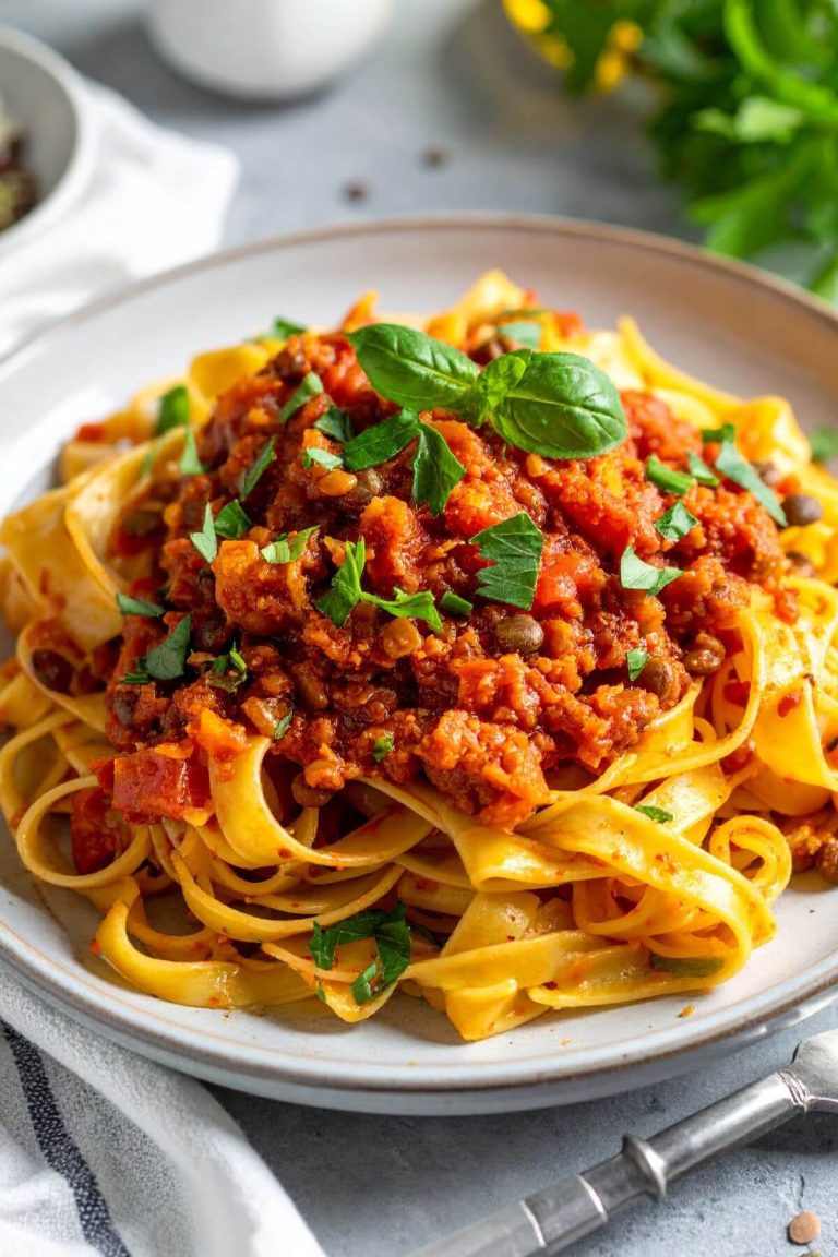 A plate of Vegan Lentil Bolognese over pasta