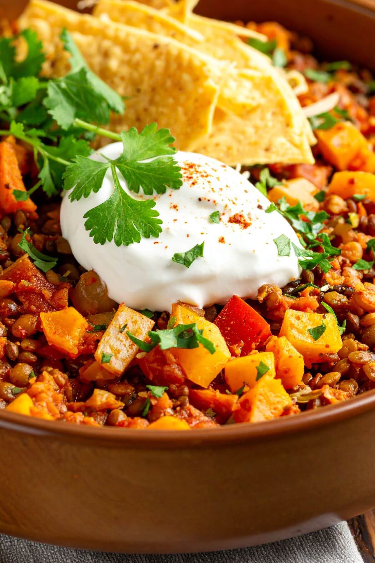 Vegan Lentil Chili with sour cream and chips