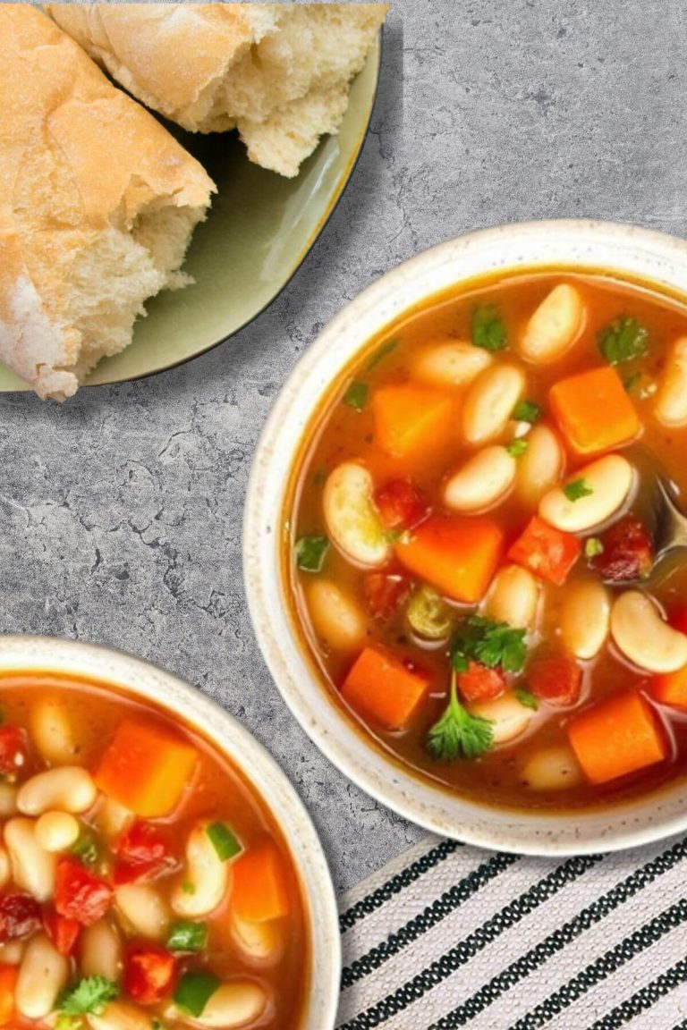 Two Bowls of Tuscan Navy Bean Soup with a side of French bread rolls