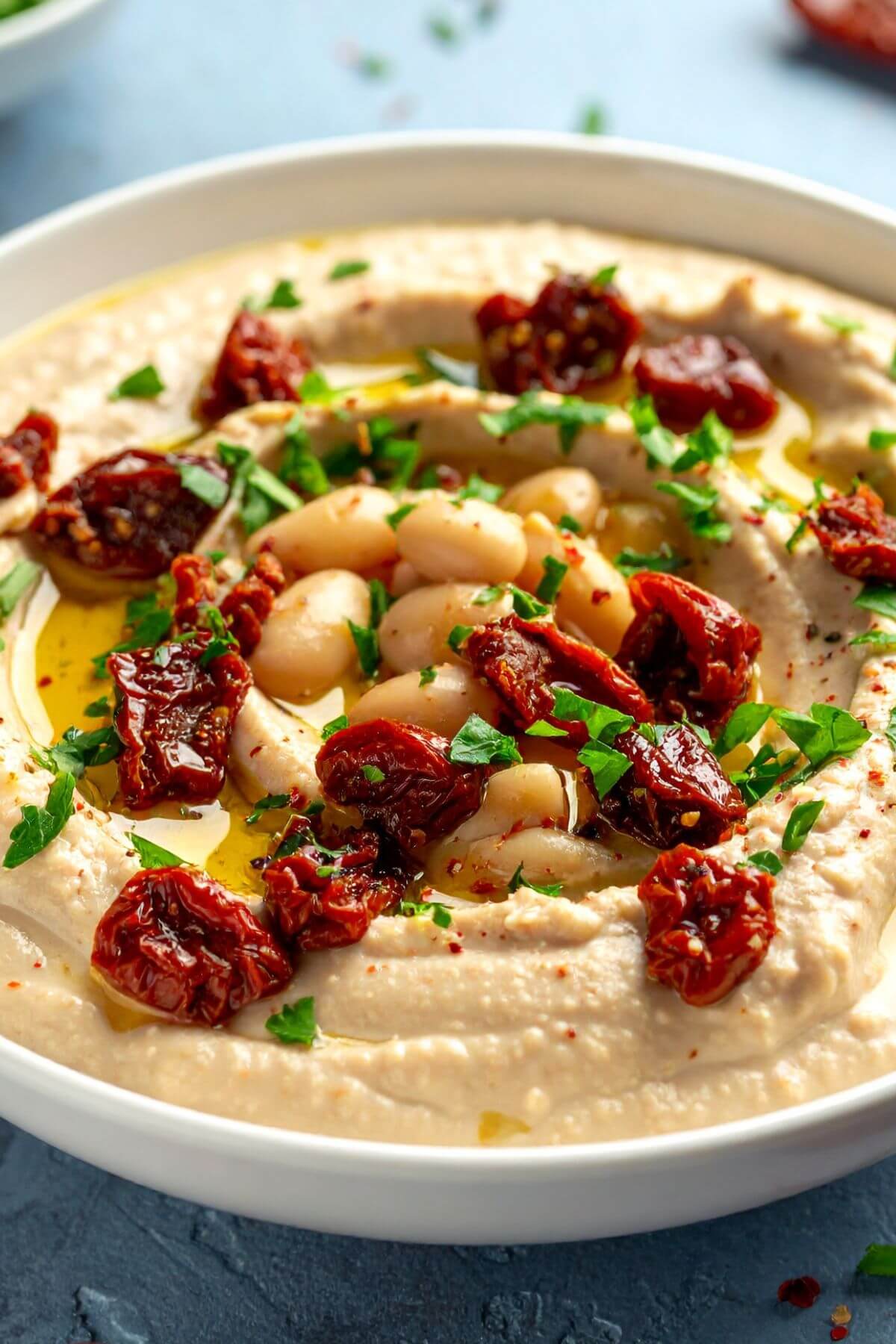 Bowl of White Bean Dip with Sundried Tomatoes in Marinade