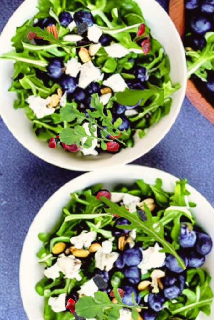 Two bowls of Arugula, Blueberry, and Feta Salad