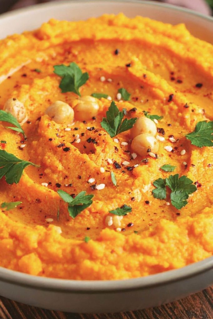 Bowl of Roasted Carrot Hummus for snacks and parties