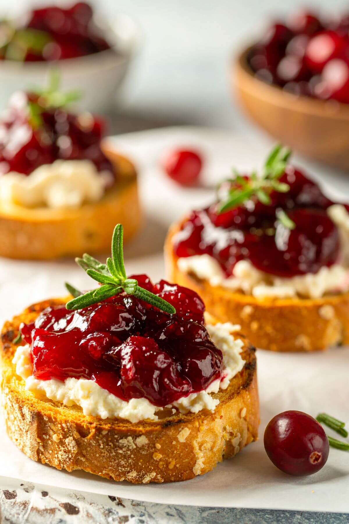 Cranberry Sauce Crostini with hearb garnishes
