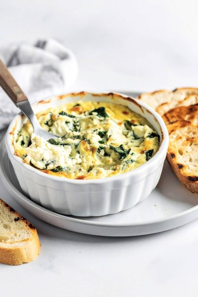 Vegan Spinach Artichoke Dip with bread slices
