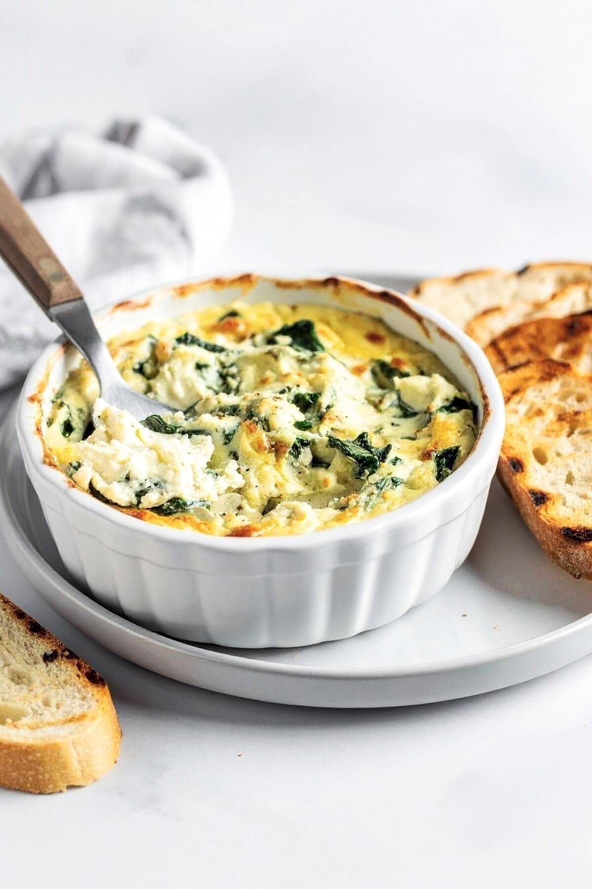 Vegan Spinach Artichoke Dip with bread slices