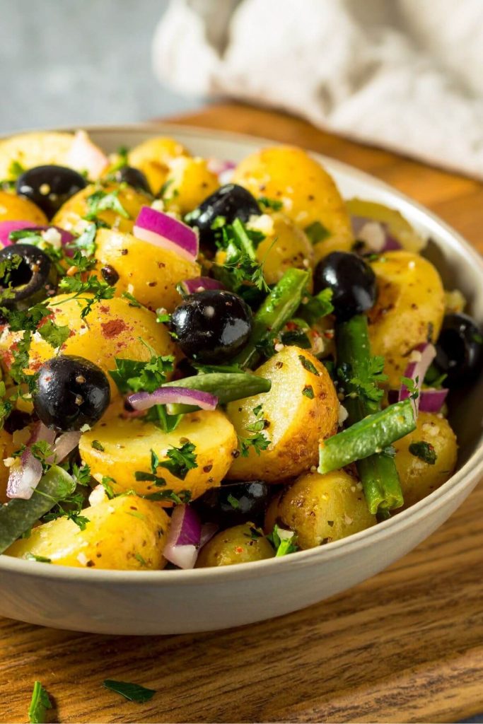 Bowl of Green bean potato salad with olives