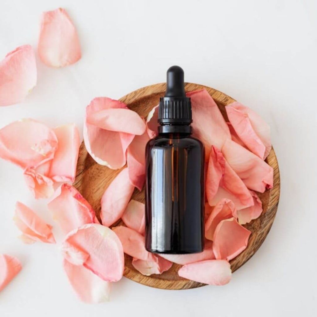 Beauty bottle on rose petals