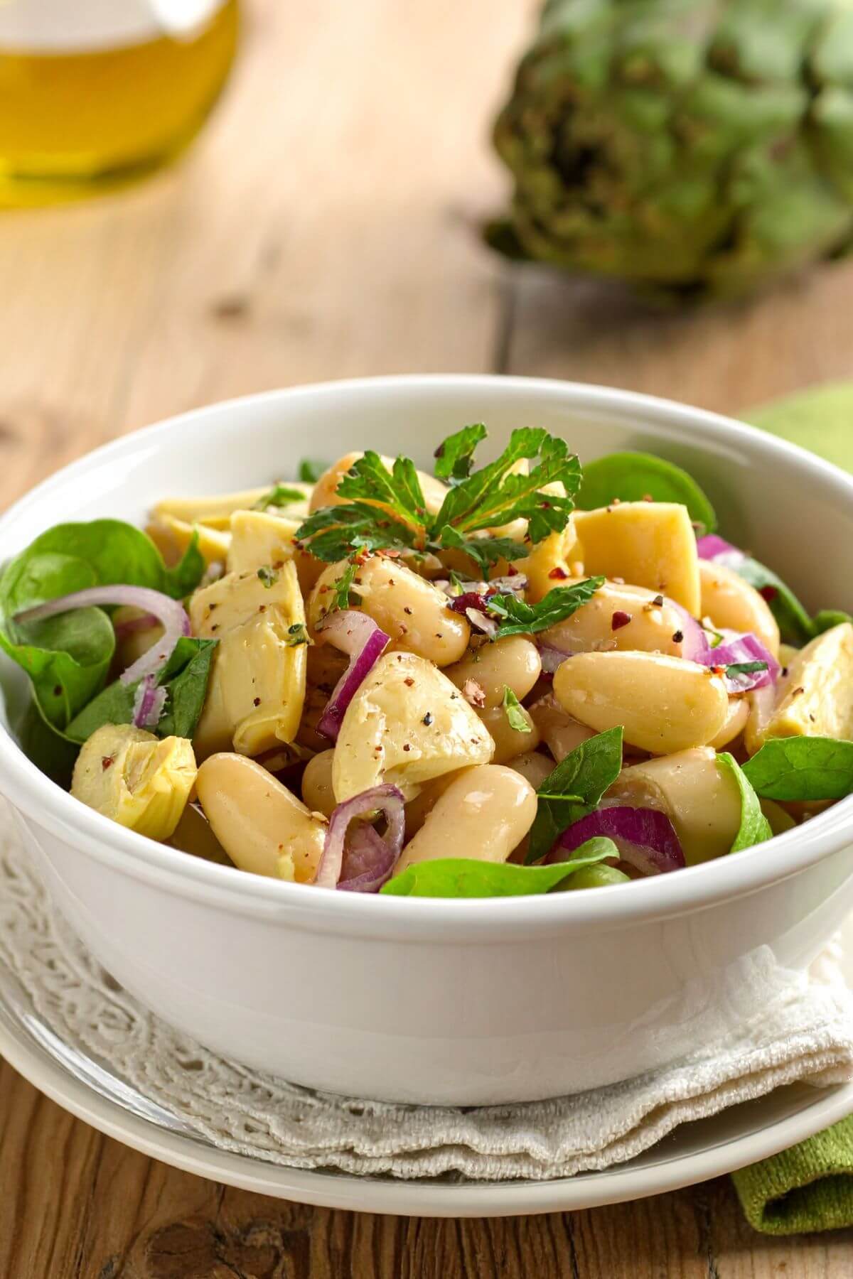 A bowl white bean and artichoke salad