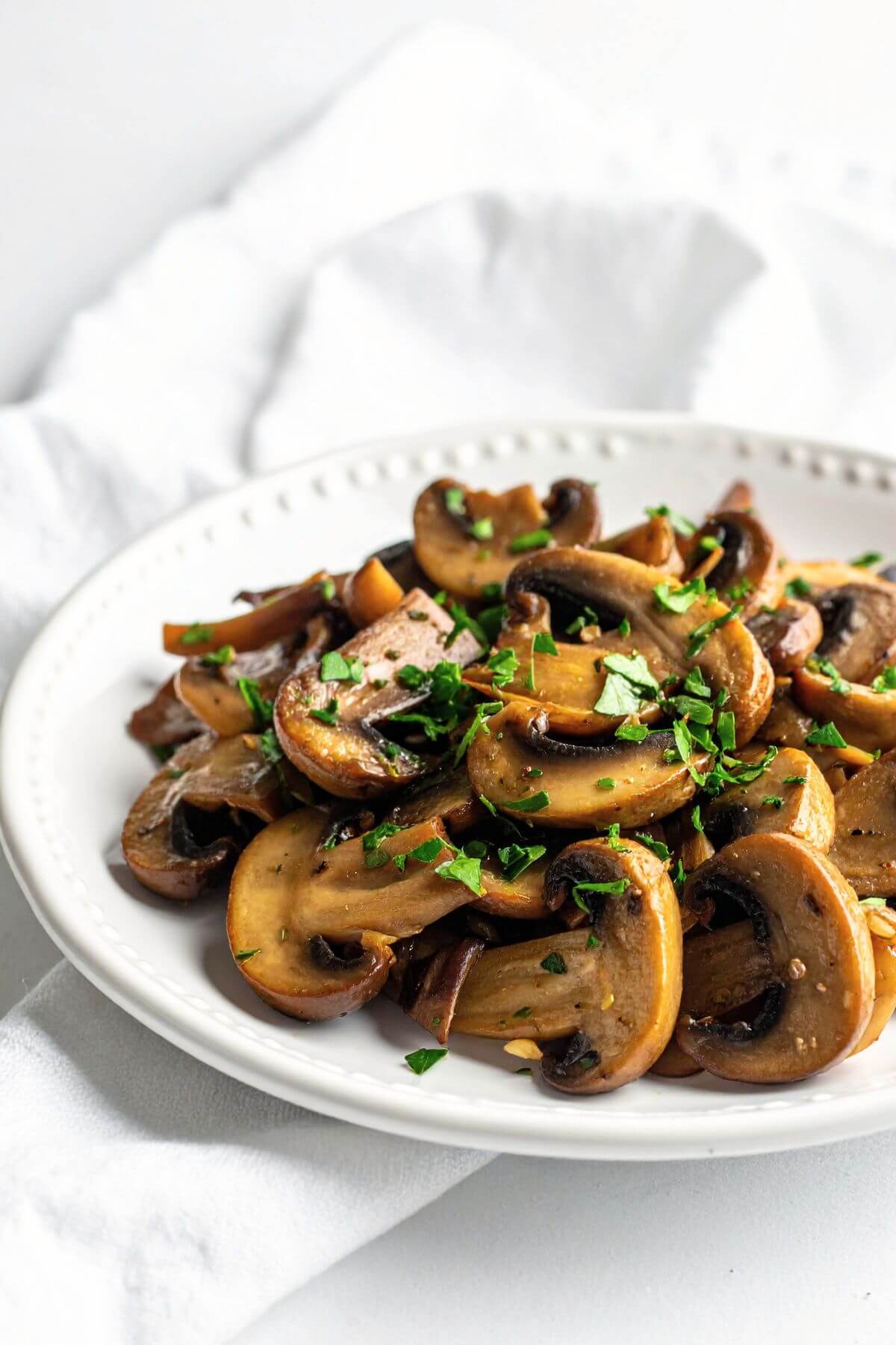 easy sautéed garlic mushrooms vegan style with herbs and butter sauce