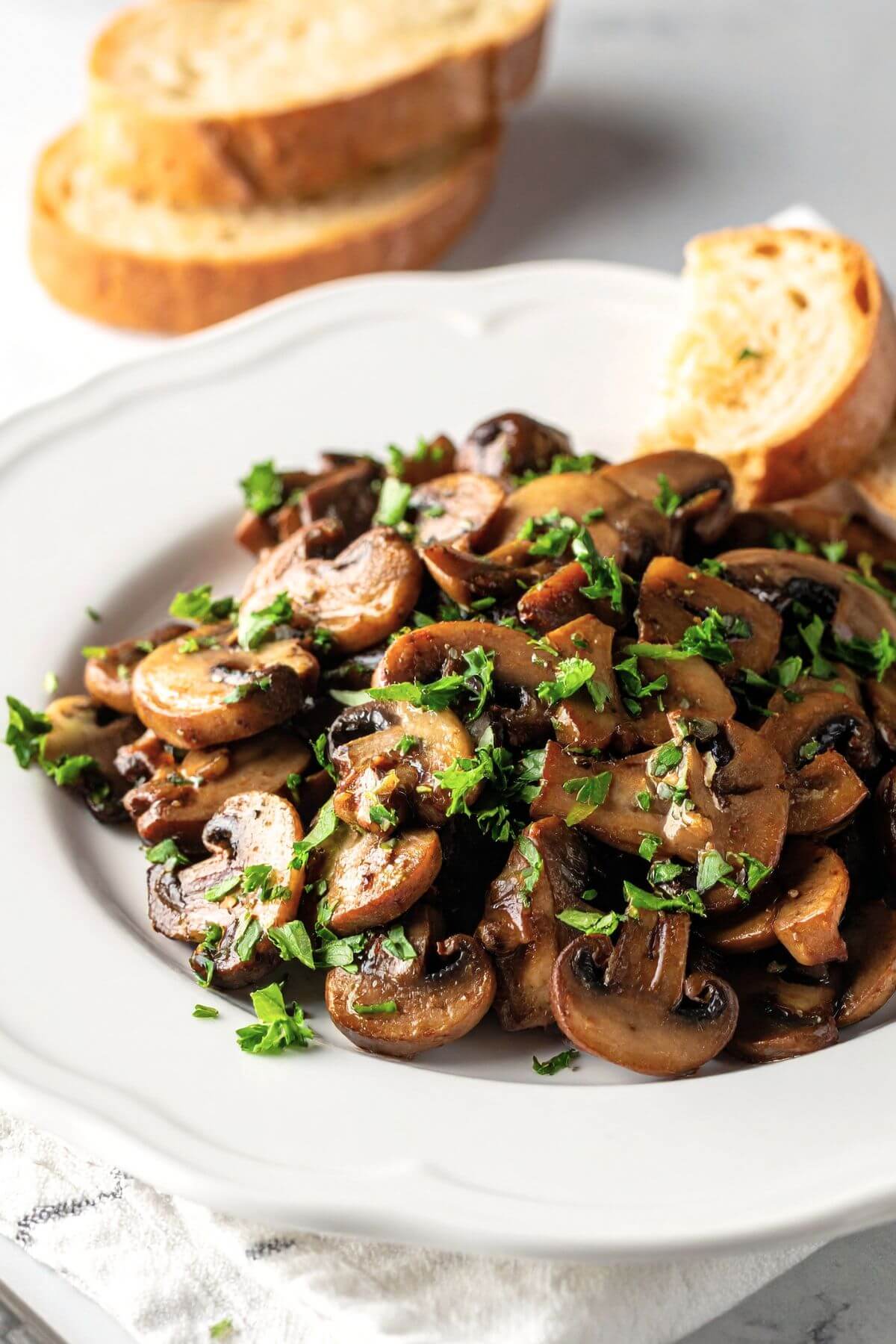 easy sautéed garlic mushrooms vegan style with herbs and butter sauce