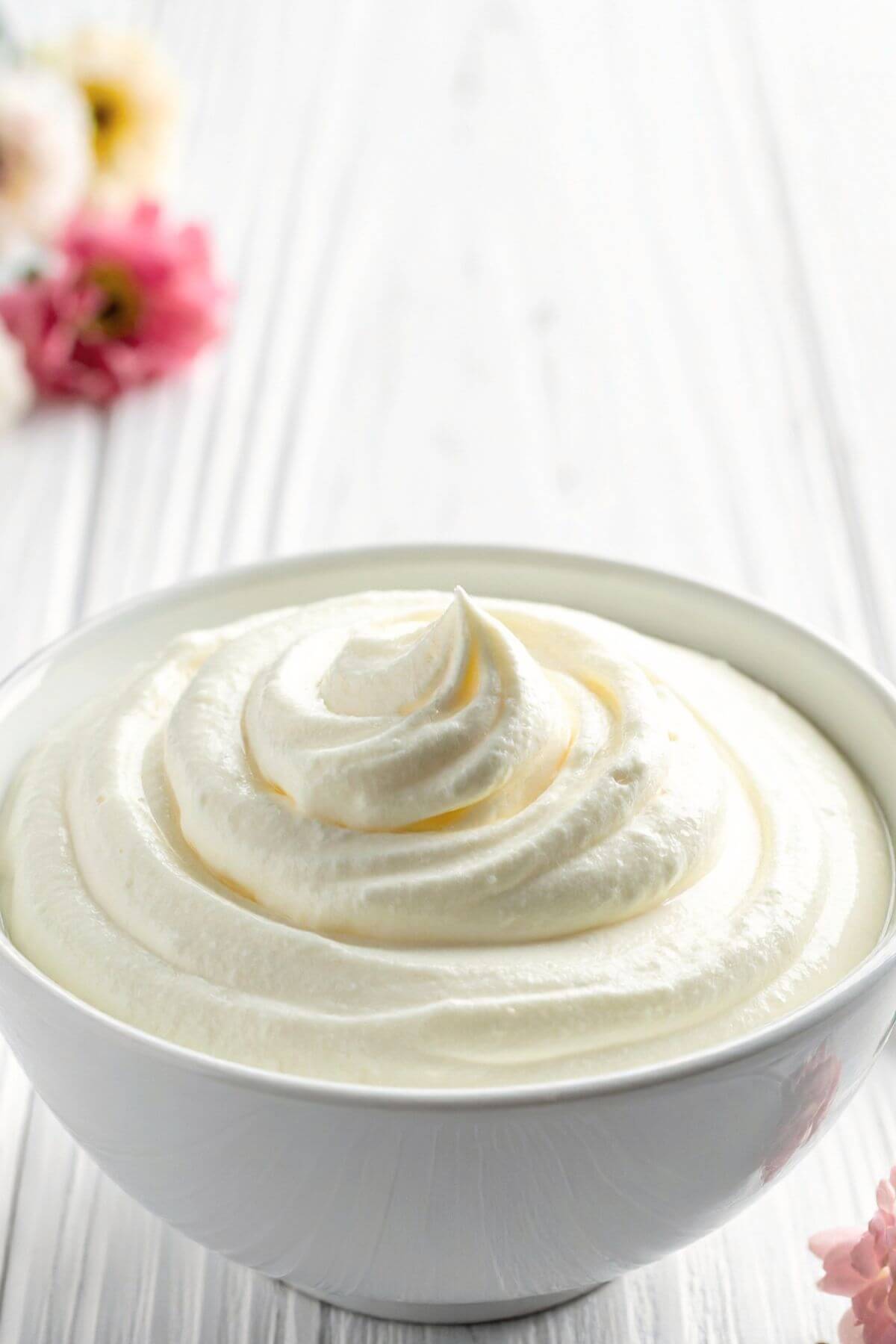 smooth vegan cream cheese frosting in a white bowl