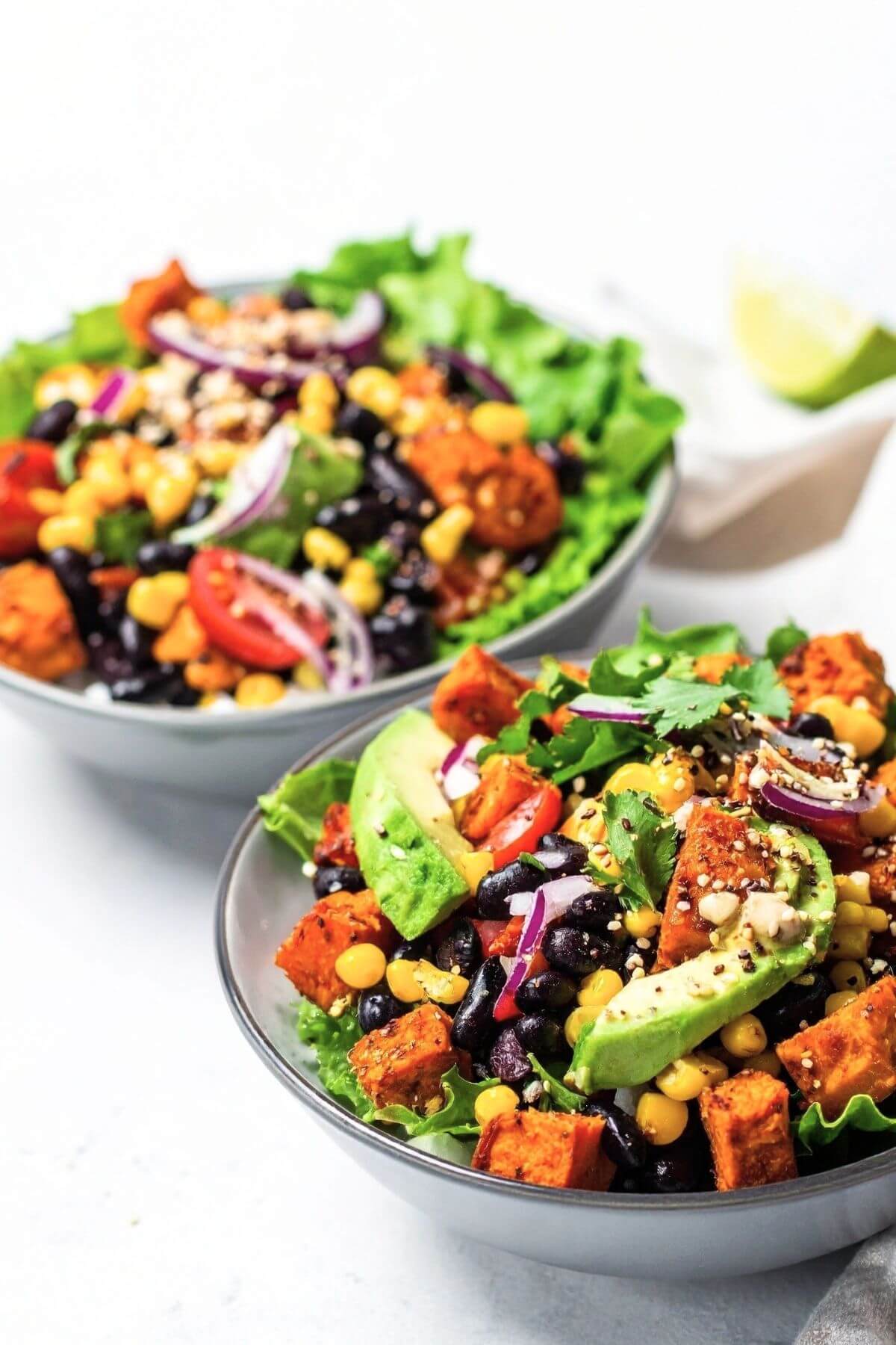 Fresh taco salad with black beans, sweet potatoes, and greens