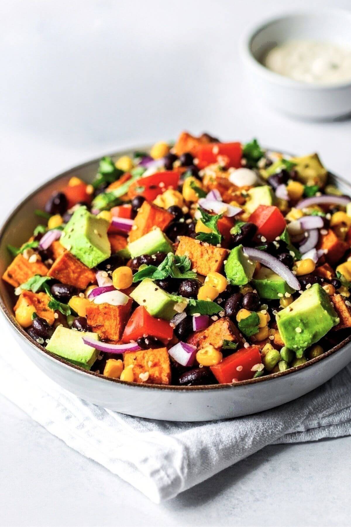 Colorful vegan taco salad with avocado and fresh vegetables