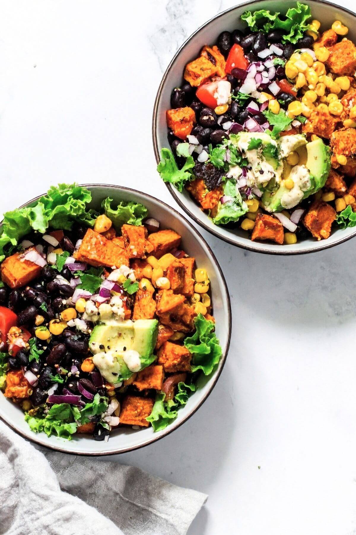 Fresh taco salad with black beans, sweet potatoes, and greens