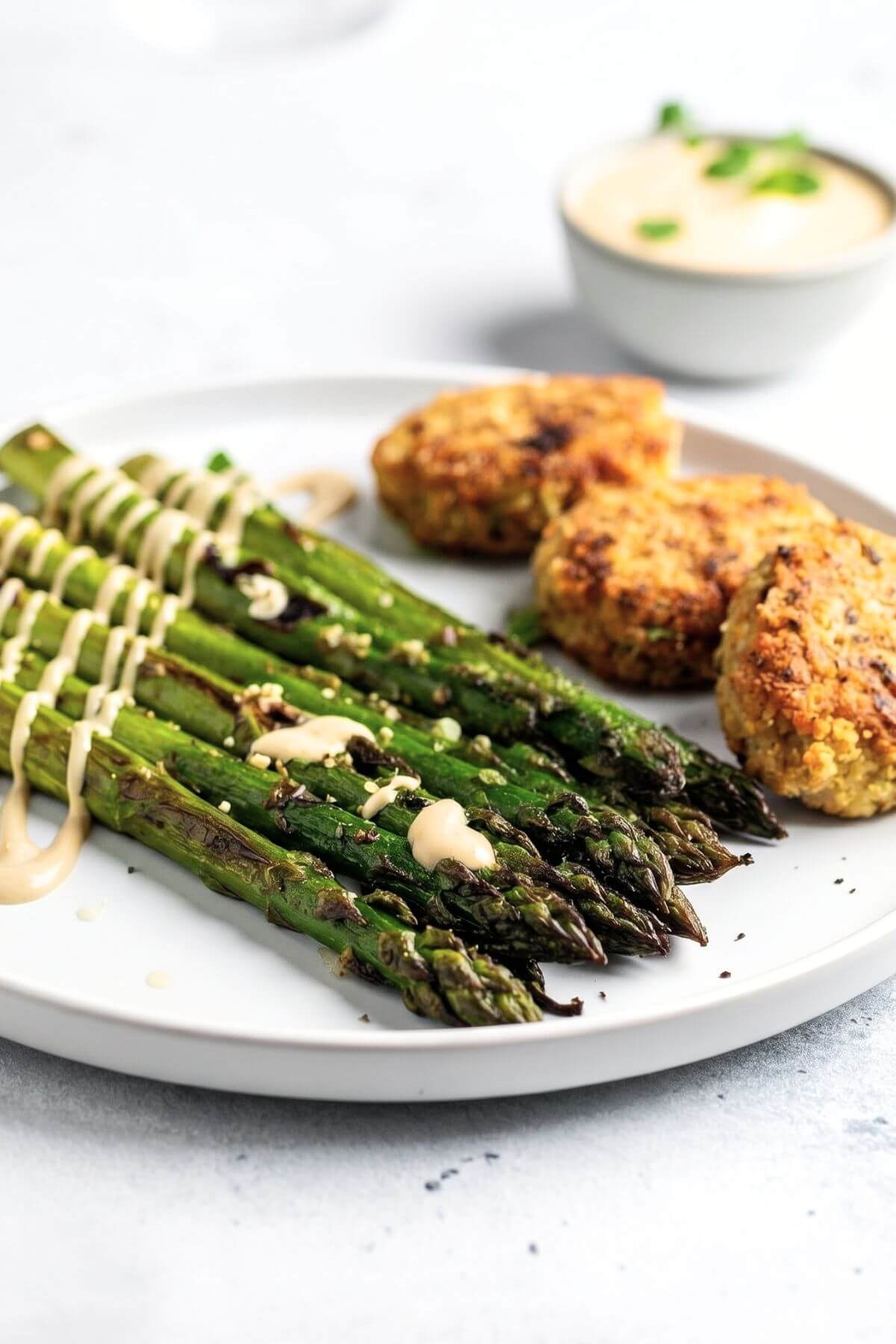 Simple roasted asparagus with creamy tahini and veggie patties for dinner